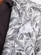 Close-up of a shirt with a black and white leaf pattern