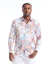Man wearing a colorful patterned shirt on a white background