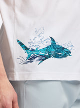 White shirt with a blue shark design on a white background
