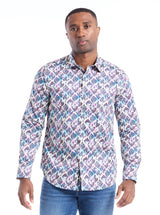 Man wearing a patterned shirt on a white background