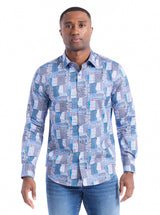 Man wearing a blue geometric patterned shirt on a white background