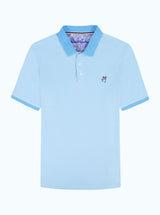 Light blue polo shirt with a small devil logo on a white background
