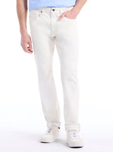 Person wearing white jeans on a white background